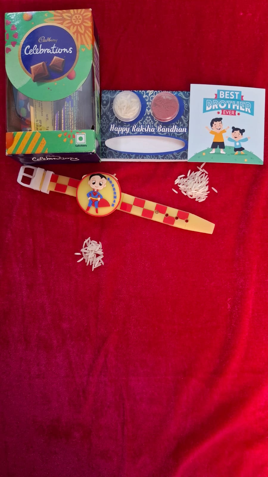Cartoon light Rakhi with Celebration Cadbury Chocolate, Roli, Chawal, and Cute Card. (Random Color&Cartoon)