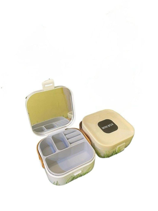 Compact and portable mini jewellery box with mirror and multiple compartments to organize earrings, necklaces, rings, and more. Ideal for travel and safekeeping. Available in random colors.
